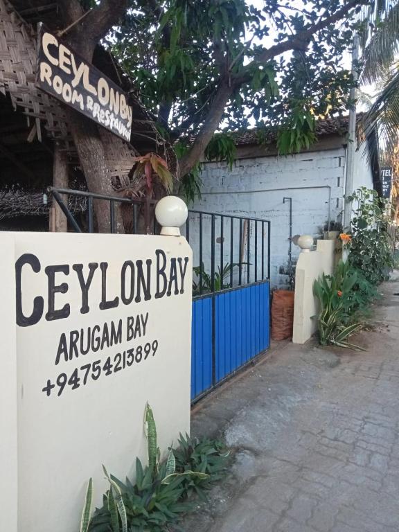 a sign for the exxon bay antigua bay at Ceylon Bay in Arugam Bay