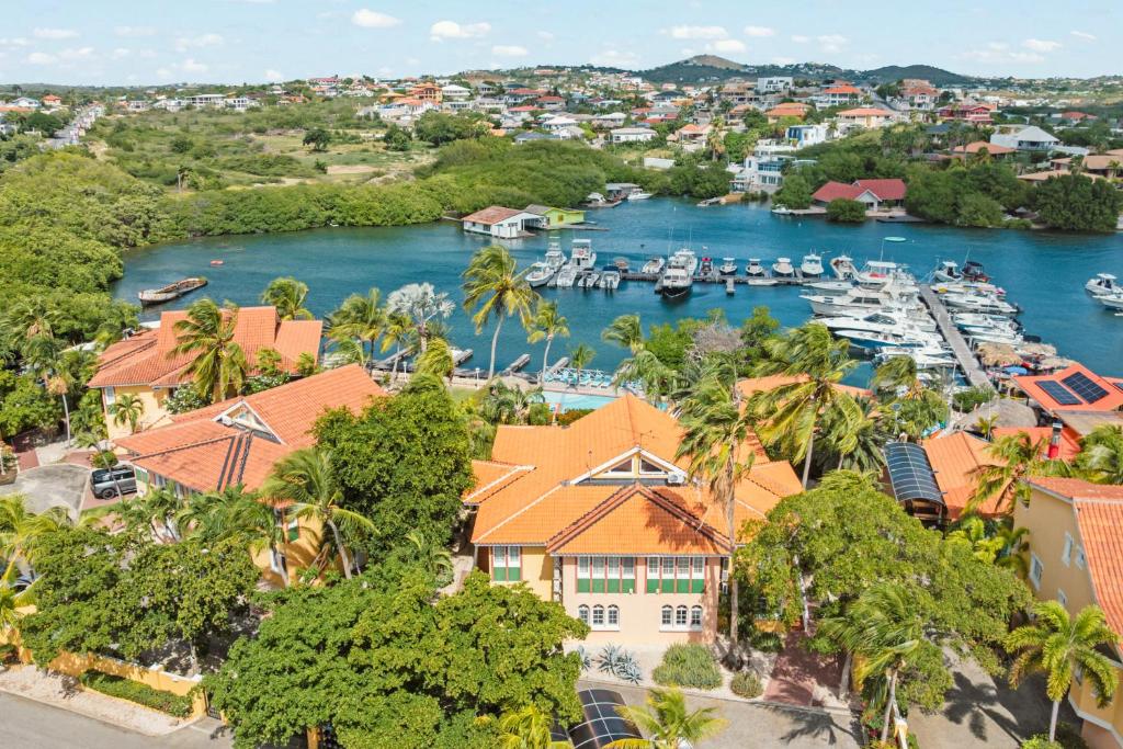 an aerial view of a marina with boats at Marina Apartment A2, luxury waterfront apartment Spanish Water, Jan Thiel, Curaçao in Jan Thiel