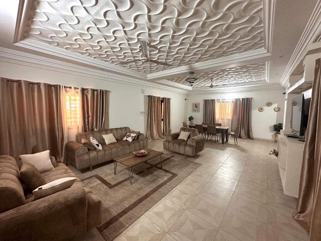 a large living room with couches and a table at Résidence du Golf in Bamako