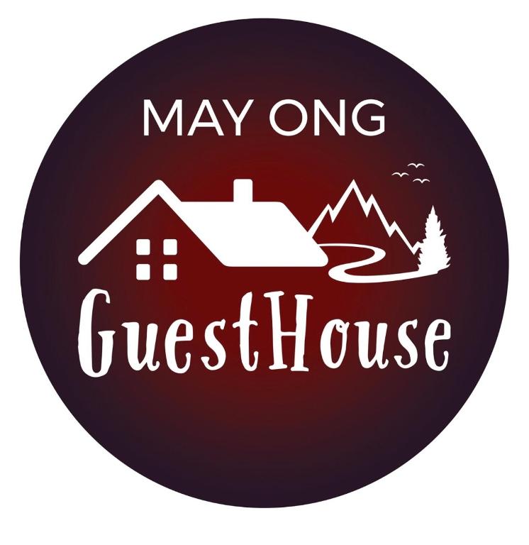 a may one guest house sign with a house and mountains at May Ong Guest House in Taiping