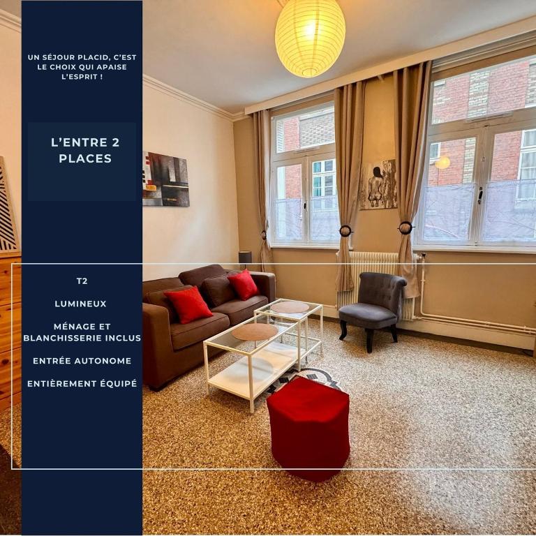 a living room with a couch and a table at L'entre 2 places, Apt 42 m² hyper centre Arras in Arras