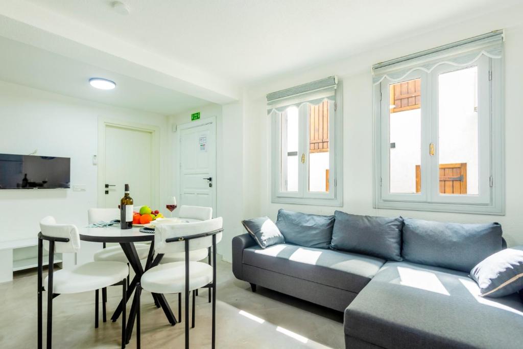 a living room with a couch and a table at Westcoast Kalkan Suites 1-bedroom suite located heart of Kalkan Old Town in Kalkan