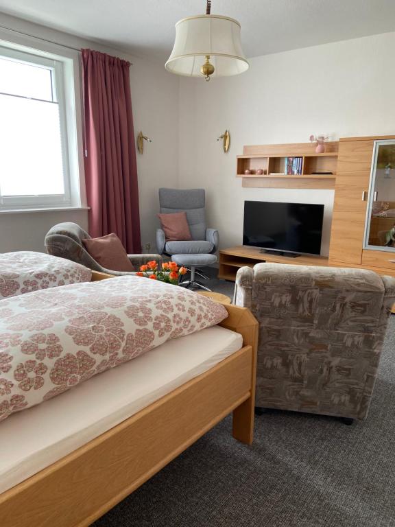 a hotel room with a bed and a living room at Glück Auf in Goslar