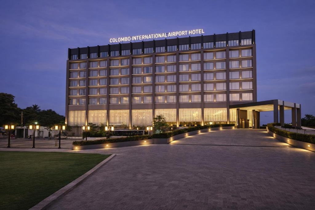 a large building with a sign on top of it at Colombo International Airport Hotel in Katunayaka