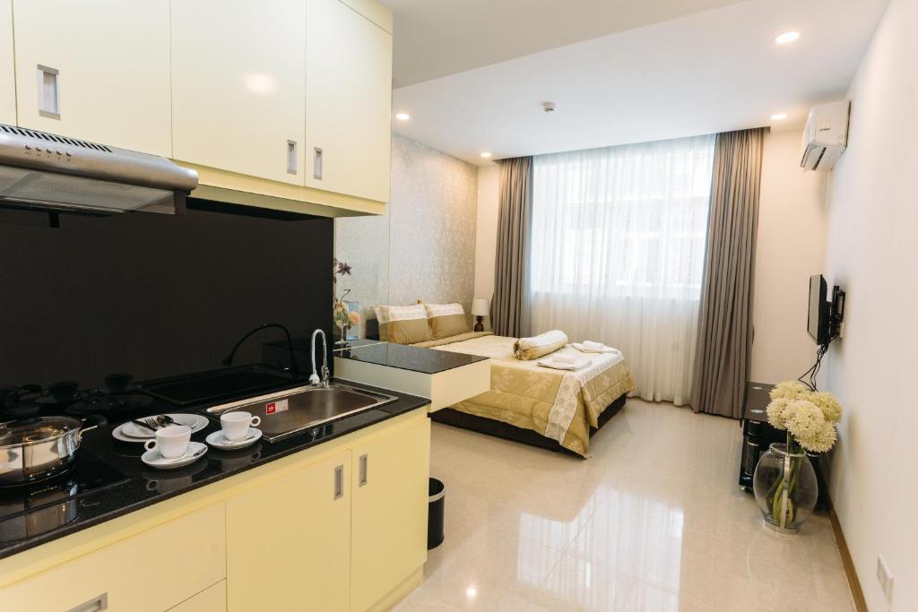 Kuchyň nebo kuchyňský kout v ubytování CA&SA Serviced Apartment