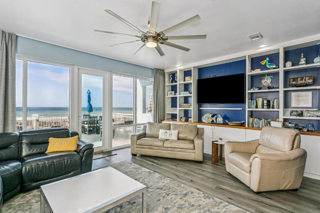 a living room with a view of the ocean at 477 Fort Pickens Rd. in Pensacola Beach