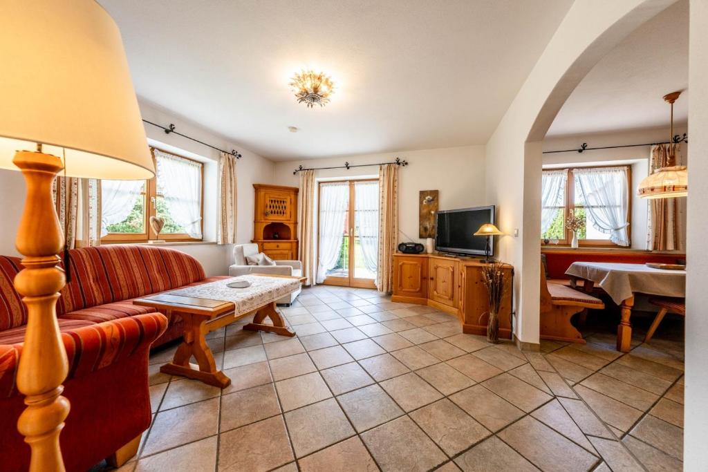 a living room with a couch and a table at Haus Lara - Fewo 1 in Wallgau