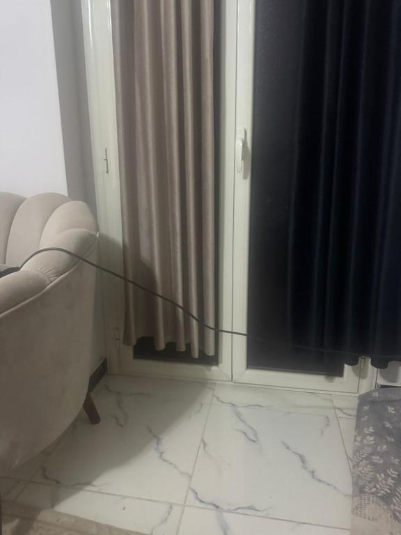 a bathroom with a tub and a shower curtain at The sun Pyramids View in Cairo