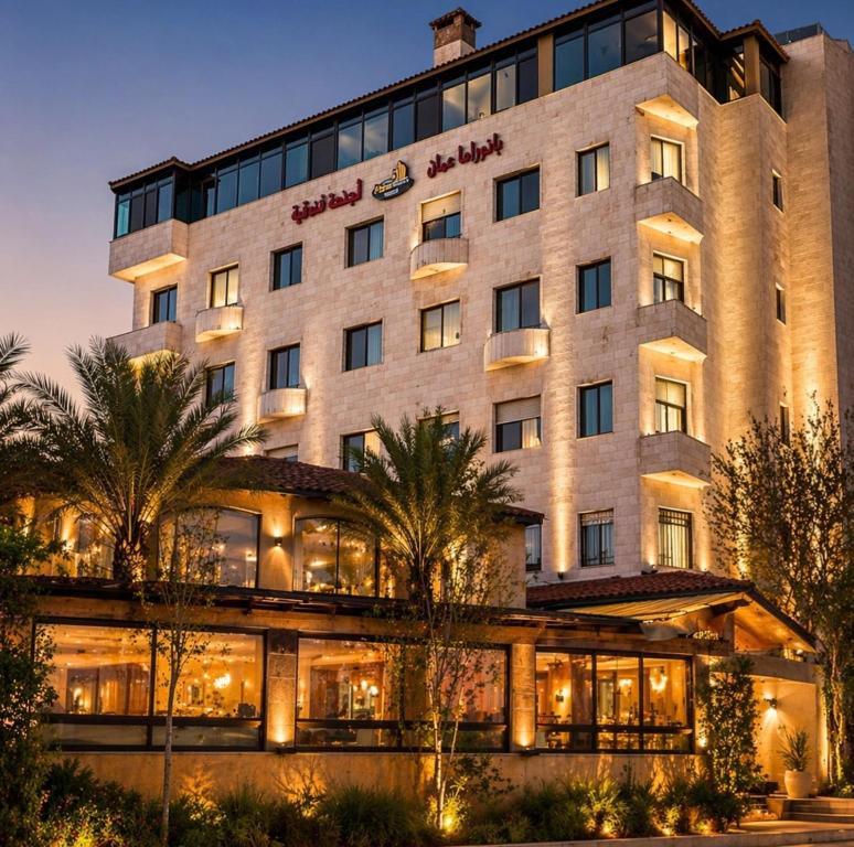 a rendering of the magellan sutera resort at night at Panorama Amman Hotel in Amman