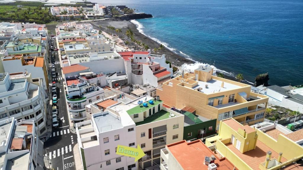 an aerial view of a city and the ocean at Sol y Playa in Puerto Naos