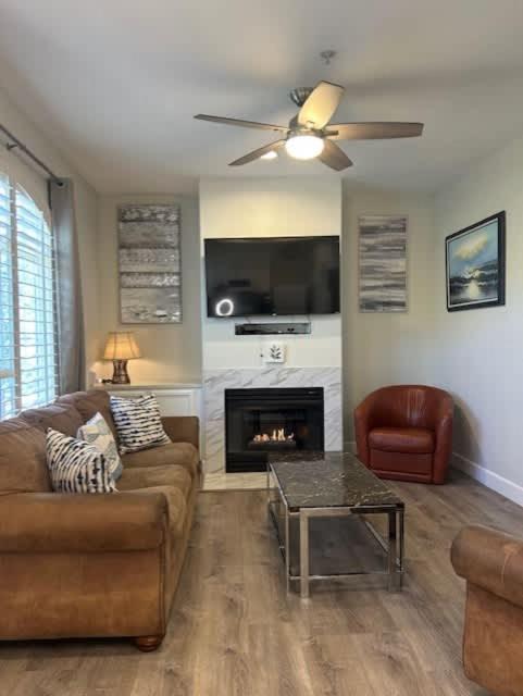 a living room with a couch and a fireplace at Tranquil Terrace in Oceano