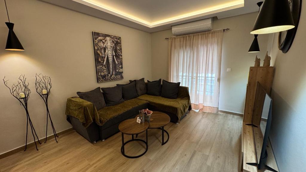 a living room with a couch and a table at imvros home luxury in Alexandroupoli