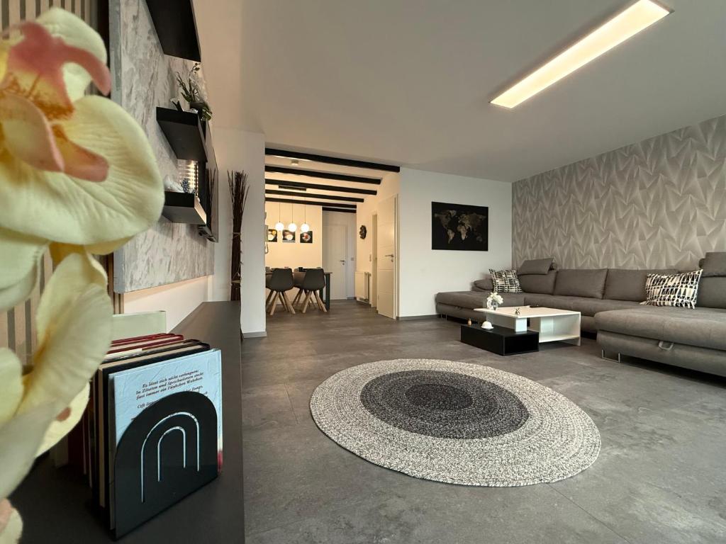 a living room with a couch and a table at Ferienwohnung W&S in Hettstedt