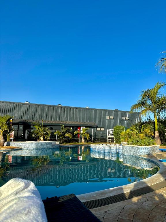 a swimming pool in front of a building at The Spring Collection in Tatu City
