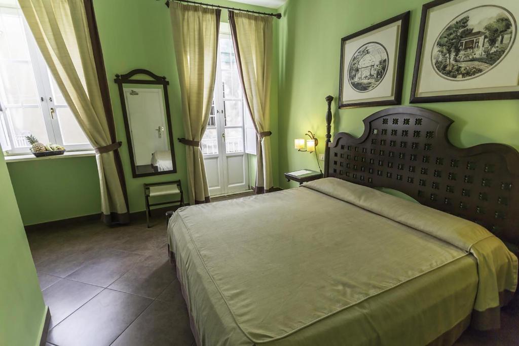Postel nebo postele na pokoji v ubytování Hotel dei Coloniali