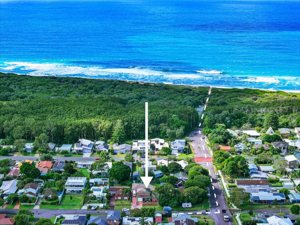 an aerial view of a town next to the ocean at Budge near the Beach in Budgewoi