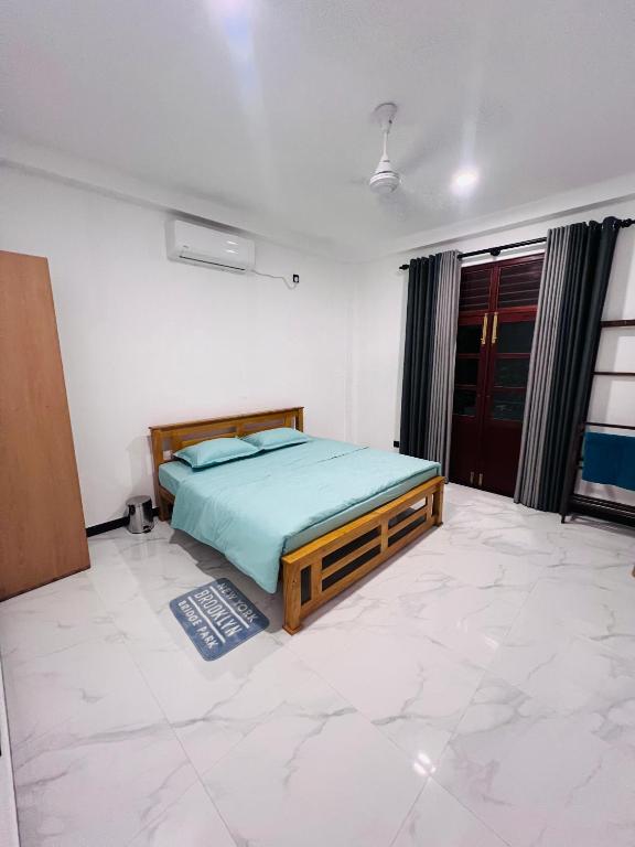 a bedroom with a bed in the middle of a room at K won Villa in Busse