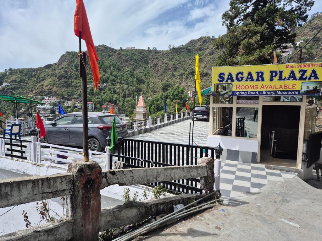 a car is parked in front of a building at Sagar plaza in Mussoorie