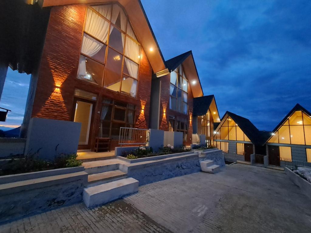 a large brick building with a lot of windows at Carika Cabin in Diyeng