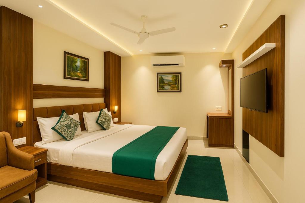 a hotel room with a bed and a television at The W H I T E Amritsar in Amritsar