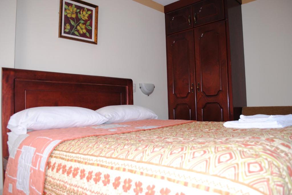 Postel nebo postele na pokoji v ubytování Hotel Caluva