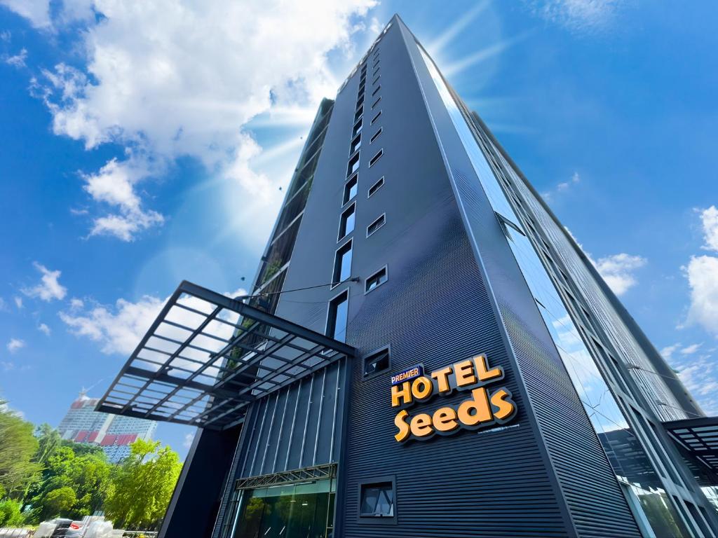 a tall building with a hotel secrets sign on it at Seeds Hotel Premier One City Subang Previously eCity Hotel One City in Subang Jaya