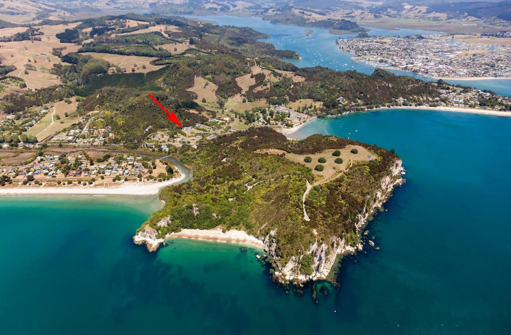 an aerial view of an island in the water at Flaxmill Cove B&B in Whitianga