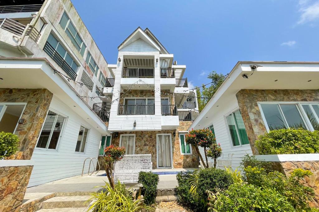 an image of a house with two buildings at Windy Ridge Hotel Tagaytay in Tagaytay