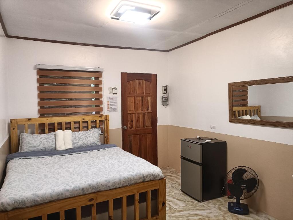 Amalia Transient Inn tesisinde bir odada yatak veya yataklar