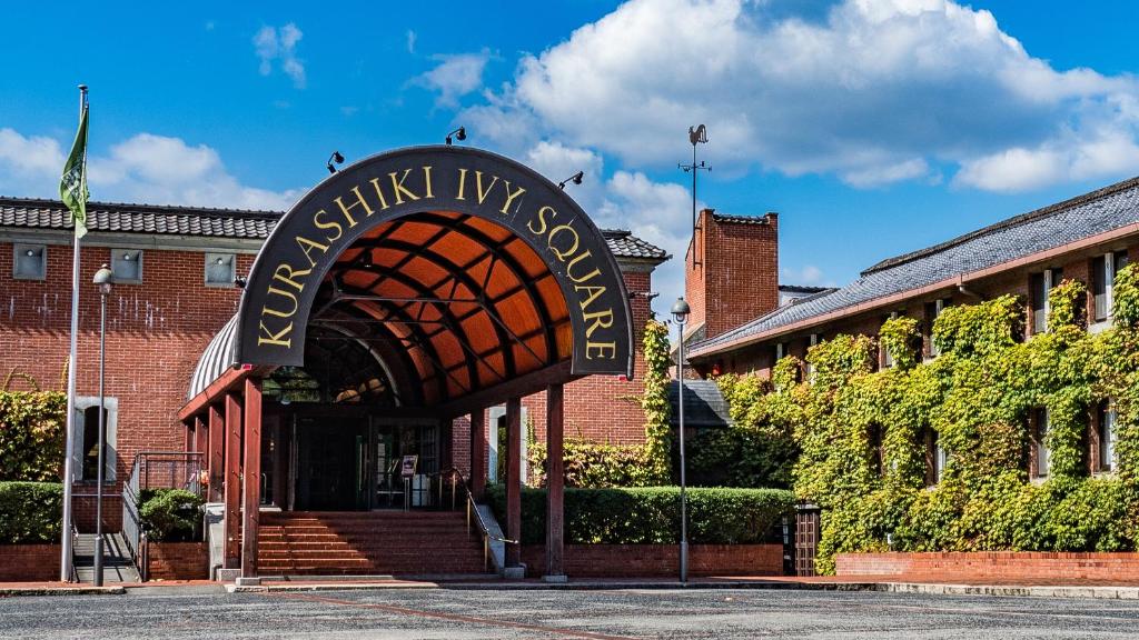 a brick building with a sign that reads central ivy gospel at Kurashiki Ivy Square in Kurashiki