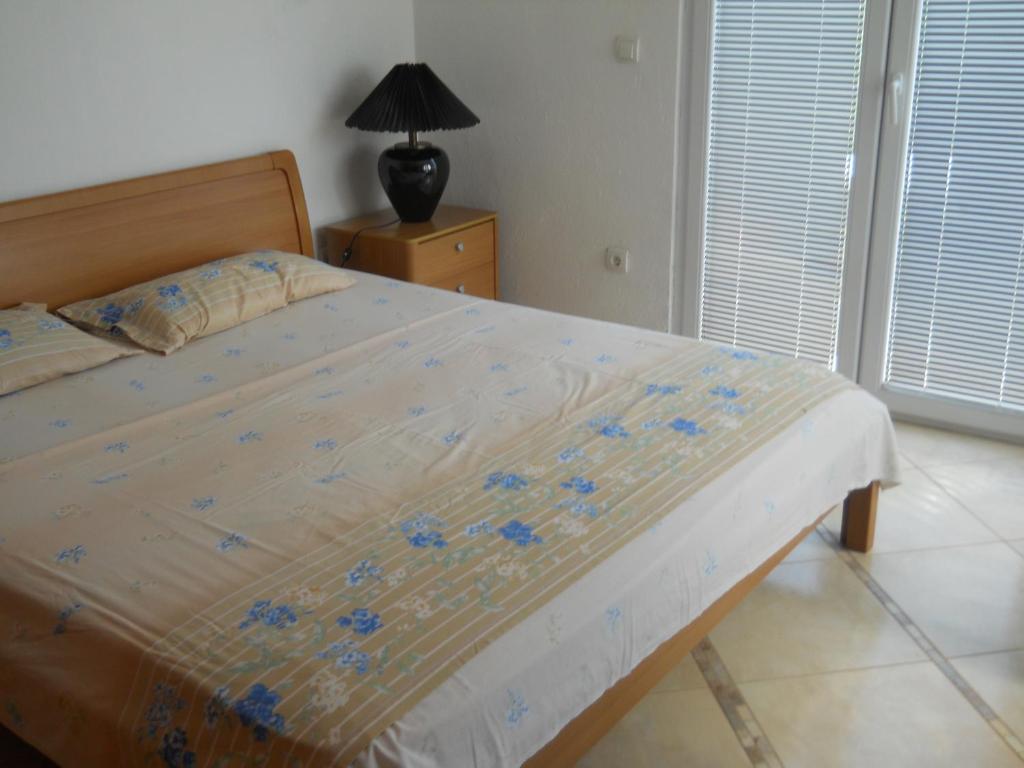 Postel nebo postele na pokoji v ubytování Apartments Ognjenović