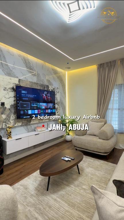 a living room with a couch and a coffee table at AA Luxury Apartments in Abuja