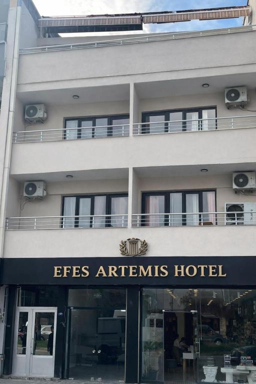 a hotel with a sign that reads esfirsagents hotel at Efes Artemis Hotel in Selçuk