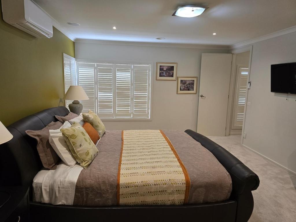 a bedroom with a large bed in a room at River view in Shepparton