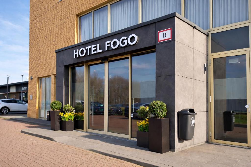 a hotel foco sign on the side of a building at Hotel Fogo Amsterdam in Amsterdam