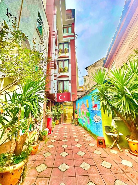 a walkway with plants in front of a building at Sultanahmet Lİfe Apart in Istanbul