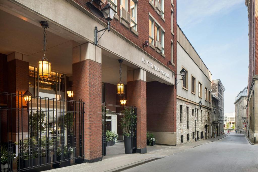 a brick building with lights on the side of a street at AC Hotel by Marriott Old Montreal in Montreal