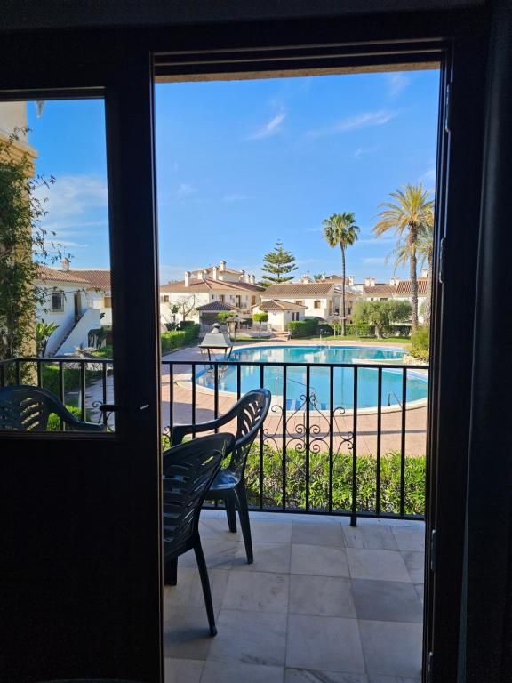 a balcony with a view of a swimming pool at Casa Indalo Vera Coast in Vera