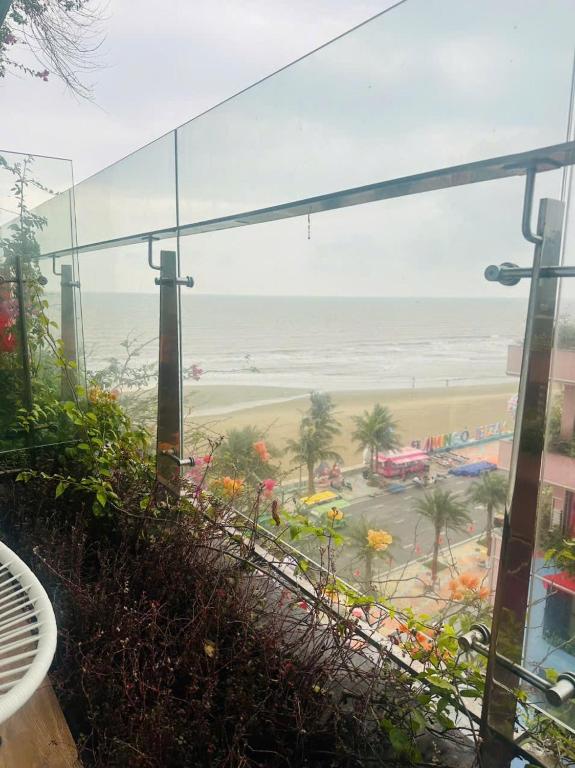 a view of the beach from the balcony of a building at Sweet Home in Gò Ba Quần