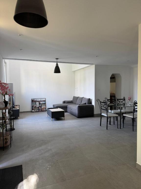 a living room with a couch and a table at sologne detente in Souesmes