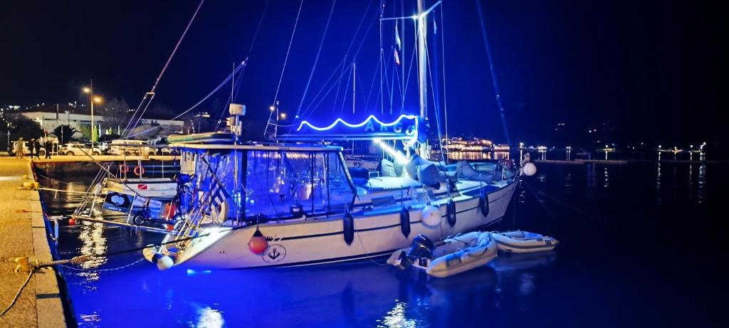 a boat is docked in a harbor at night at ARGO III Sailing Yacht in Skiathos