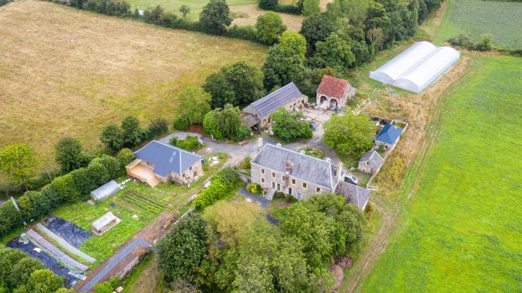 an aerial view of a large house with a barn at Ferme du ru paisible in Tournières
