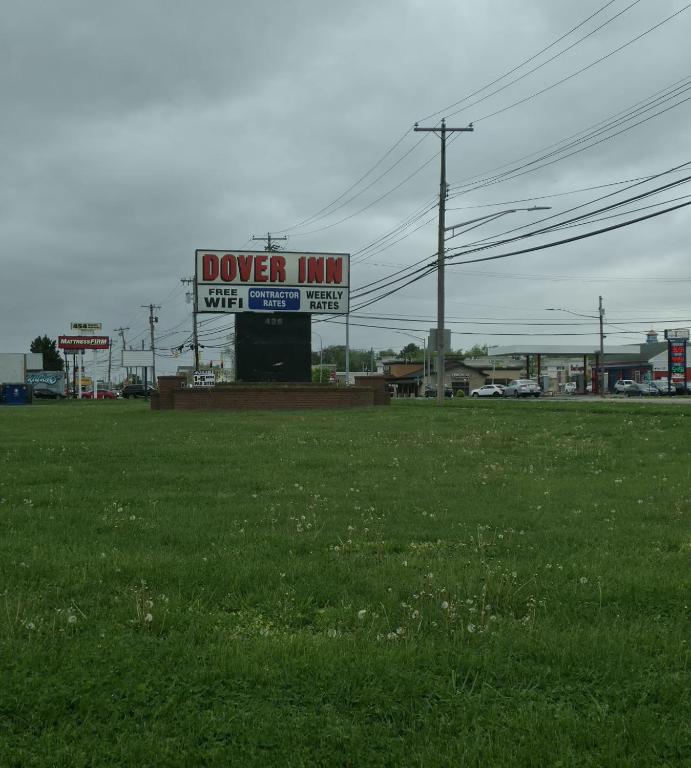 a dover inn sign in a field of grass at Dover Inn in Dover