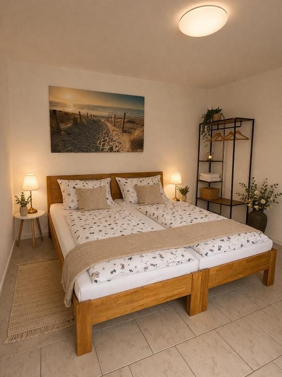 a bedroom with a large wooden bed in a room at Deniz Apartments in Kappel-Grafenhausen