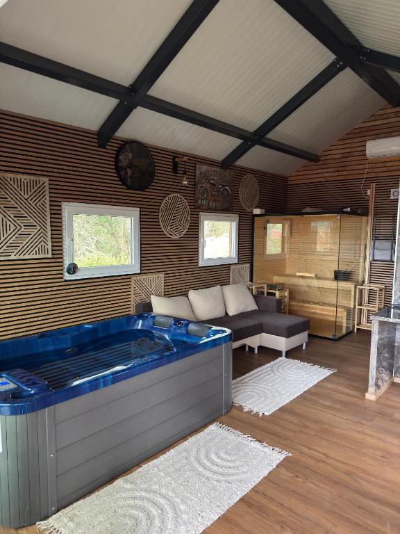 a large jacuzzi tub in a room at Secret Forest Retreat in Ptujska Gora