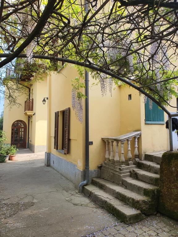 a building with stairs in front of a building at Collina del Milanese in San Colombano al Lambro
