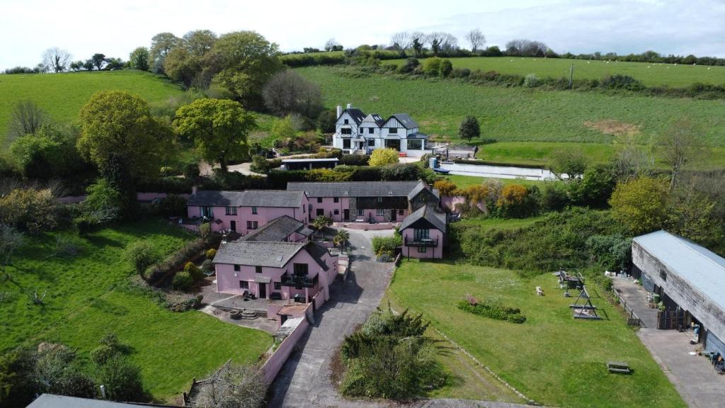 an aerial view of a house in the countryside at The Farmhouse in Teignmouth