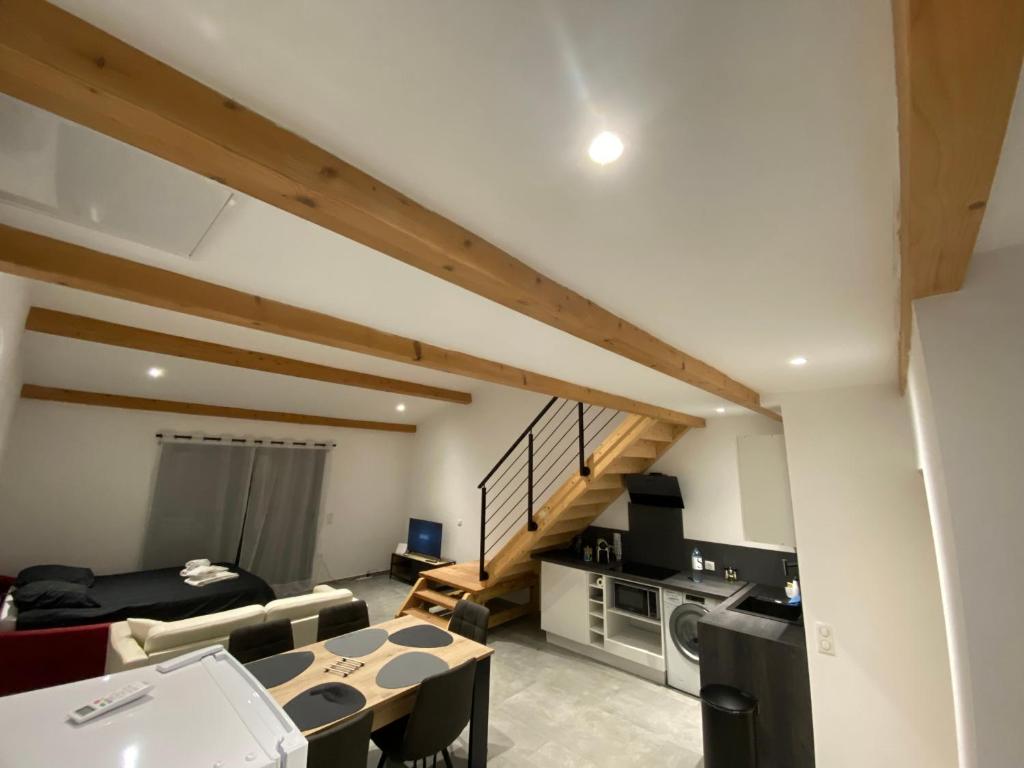 a living room with a couch and a table at Alata Appartement T3 in Alata