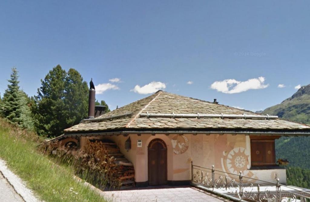 a small house on the side of a hill at Apartment in Sankt Moritz in St. Moritz
