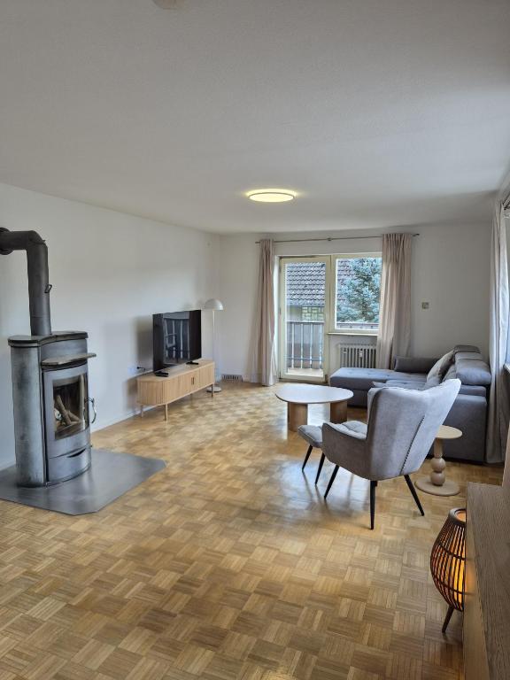 a living room with a couch and a fireplace at Ferienwohnung KönigSonne in Lauda-Königshofen